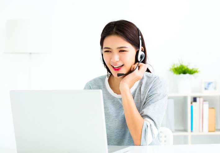 a Young Chinese teacher is teaching Chinese online via video conference.