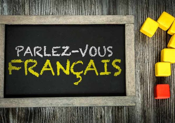 On a tablet it says "Parlez-vous français?", Do you speak French?