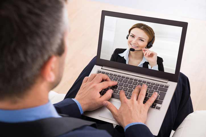 A business French course, the participant is talking to his teacher via video chat.