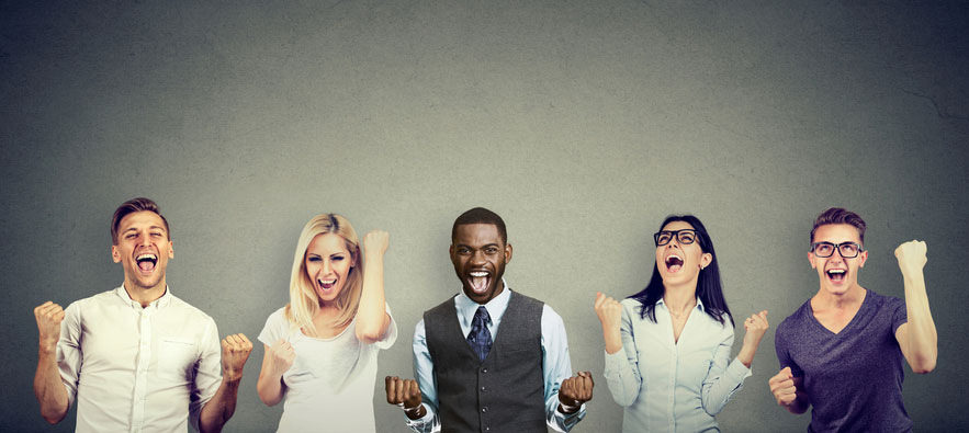 A group of young people are cheering as they have passed their German exam.