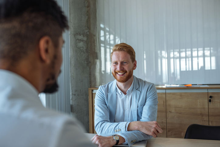 A business man is learning Italian in a tailor-made one-to-one Italian course.