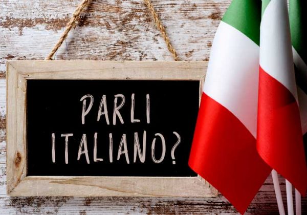 On a tablet i t says "Parli italiano?", Do you speak Italian?