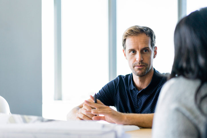 Swiss-German one-to-one course. The teacher and the student are sitting at a table.  